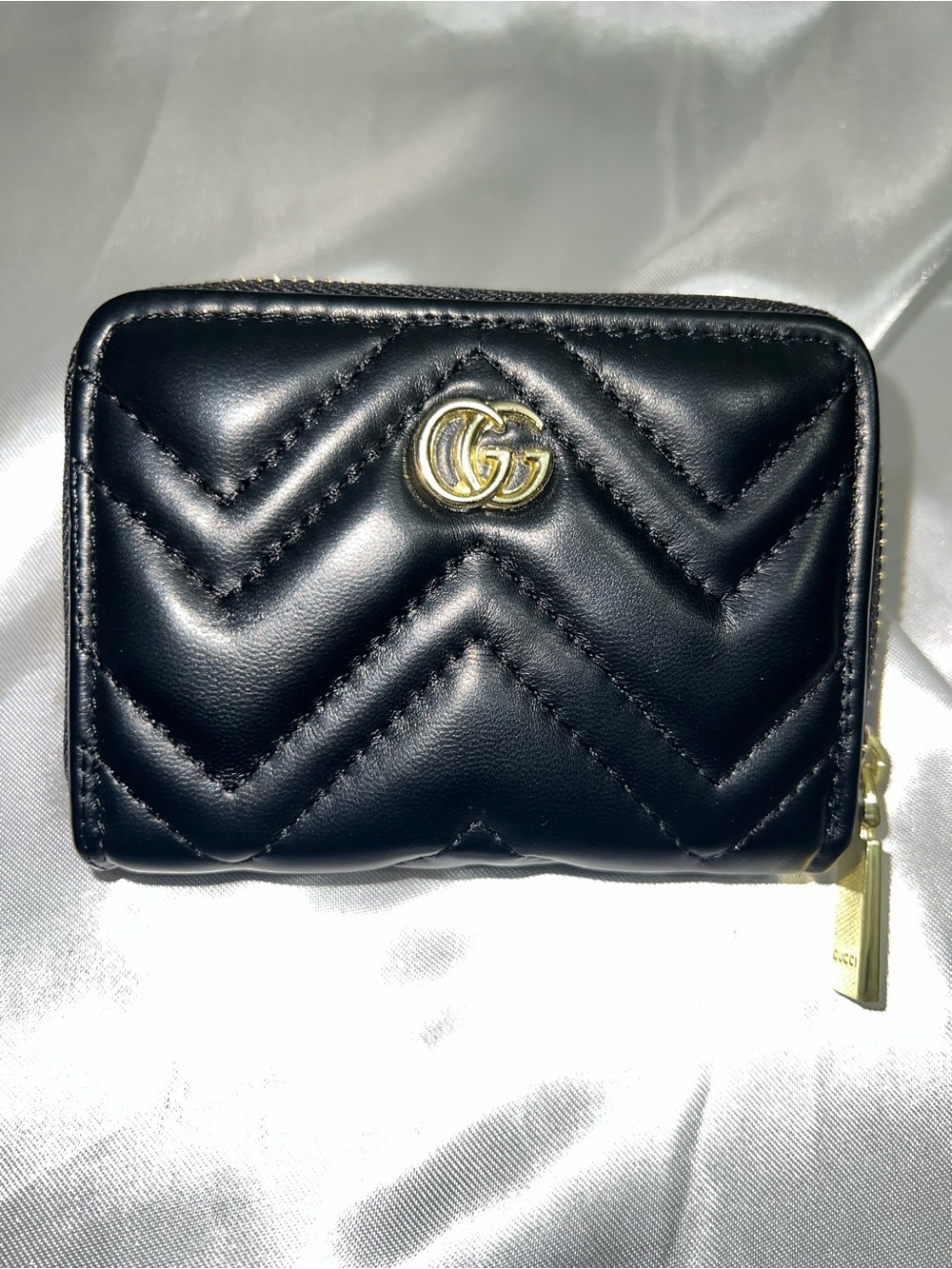 Black Quilted Leather Zip Wallet with Gold Emblem